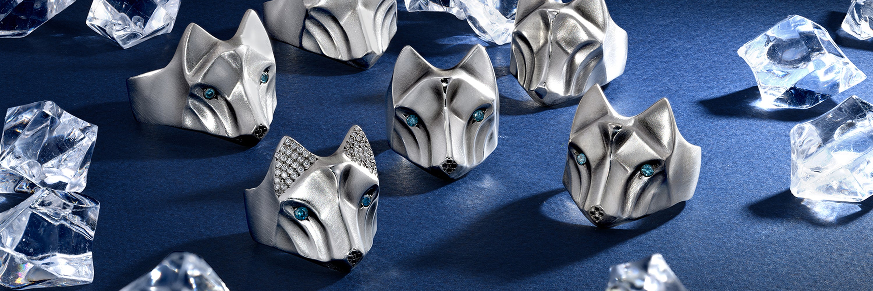 Handcrafted wolf jewelry collection featuring sterling silver wolf rings, necklaces, and pendants by Elina Gleizer Jewelry