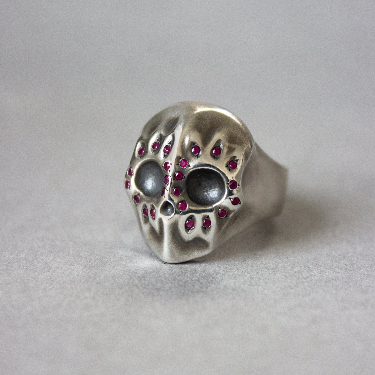 Handmade sterling silver ruby flower skull ring with red rubies