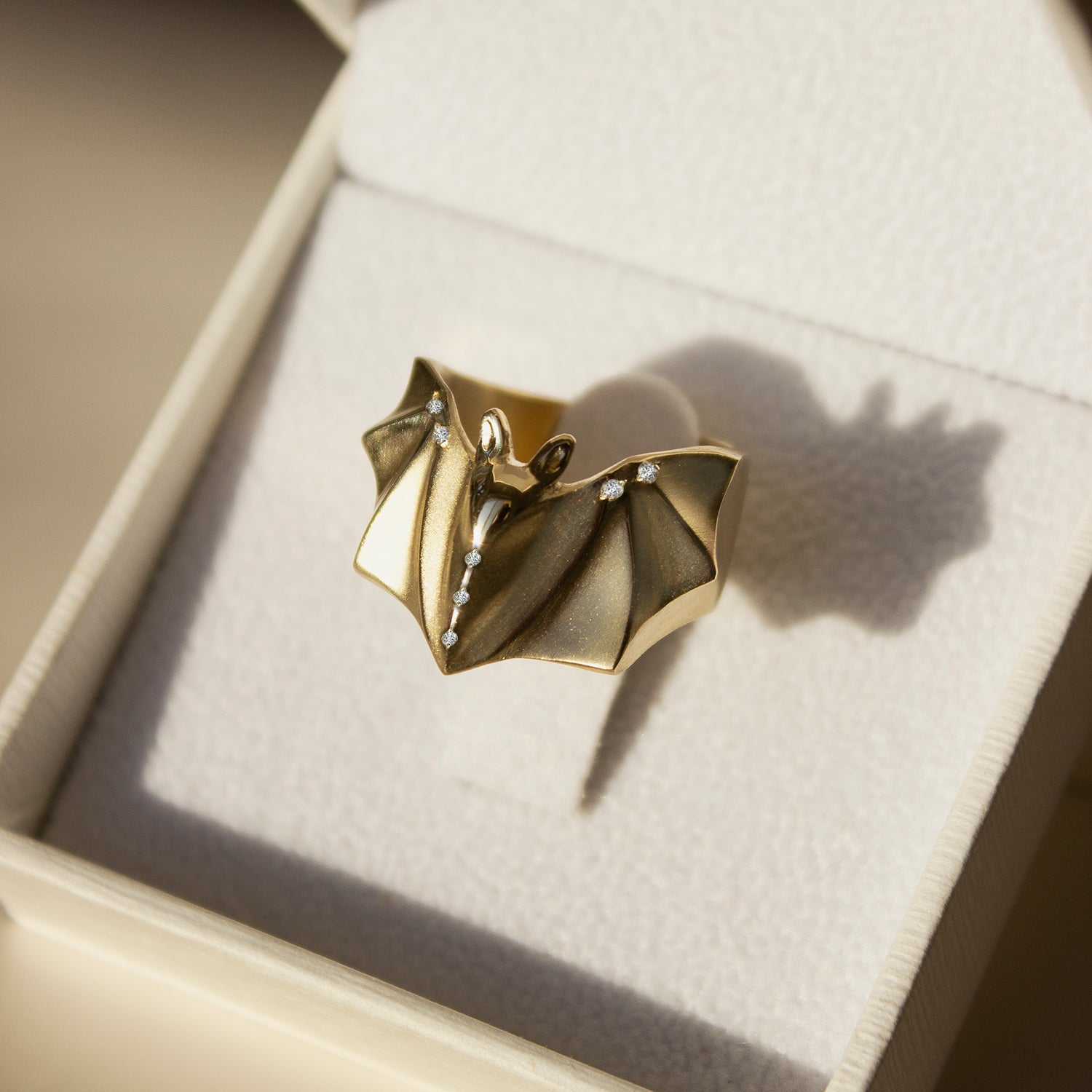 14K solid gold bat ring with 7 clear diamonds by Elina Gleizer